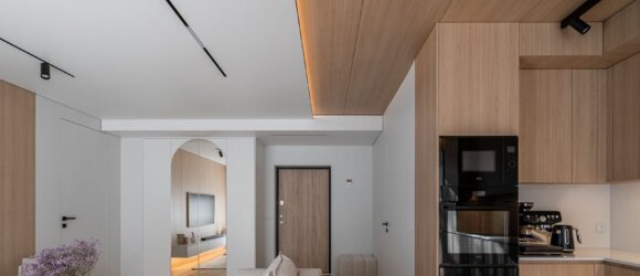 Stylish apartment with stretch ceiling and smart magnetic track system by interior designer in Barcelona, Spain