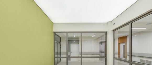 Illuminated fabric stretch ceiling in clinic